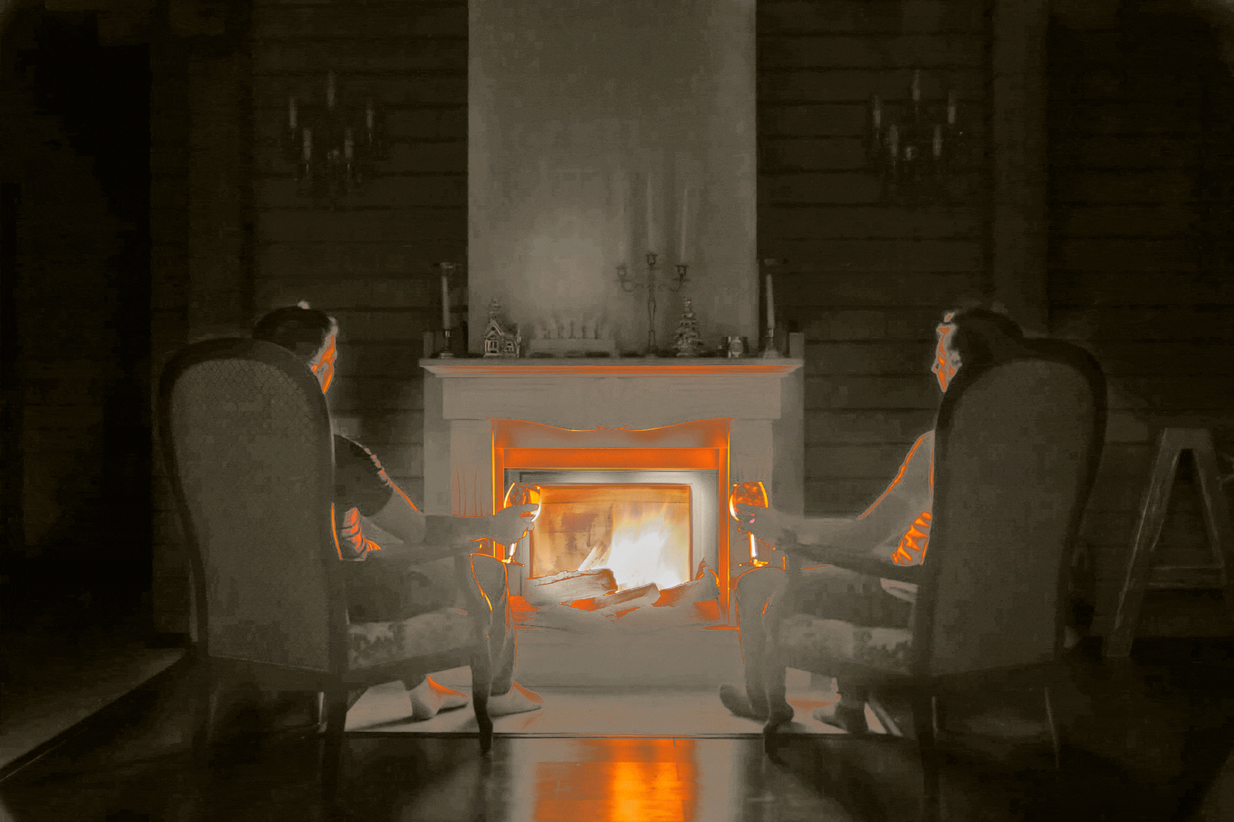 People seated around glowing fireplace